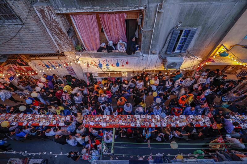 Egyptian Muslims gather for the mass iftar meal