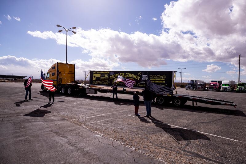 Protesters and lorry drivers start gathering before the departure of the People's Convoy, at the Adelanto Stadium, Adelanto, California, on February 22, 2022. EPA