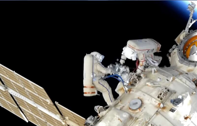 In this photo taken from video footage released by Roscosmos Space Agency, Roscosmos' cosmonauts Oleg Artemyev and Denis Matveev are seen during their spacewalk on the International Space Station (ISS) on Monday, April 18, 2022. Roscosmos Space Agency via AP