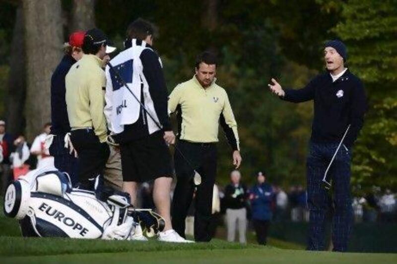 Jim Furyk, right, argues his point about Europe not getting a free drop at the second hole during the opening foursome of the 2012 Ryder Cup.