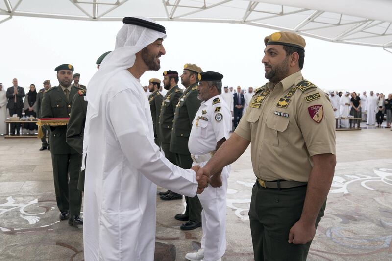 ABU DHABI, UNITED ARAB EMIRATES - April 23, 2018: HH Sheikh Mohamed bin Zayed Al Nahyan Crown Prince of Abu Dhabi Deputy Supreme Commander of the UAE Armed Forces (L), awards a member of the UAE Armed Forces with a Medal of Bravery for his service in Yemen, during a Sea Palace barza.

( Mohamed Al Hammadi / Crown Prince Court - Abu Dhabi )
---