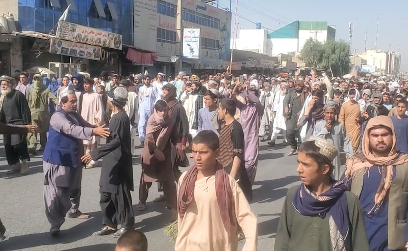 People hold a protest march against the Taliban's decision to force them to leave their homes in Kandahar, Afghanistan, in this still image taken from video. REUTERS