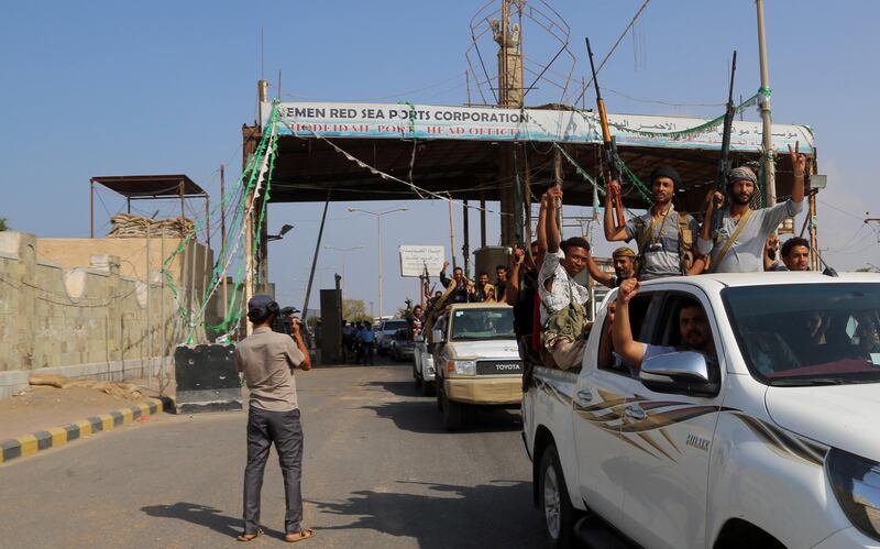 Yemeni Shiite Huthi rebel fighters are pictured in the port city of Hodeidah on December 29, 2018, as the beginning of their pull back from the Red Sea port was announced.   Yemeni rebels have begun to withdraw from the lifeline port of Hodeida, under an agreement reached in Sweden earlier this month, a UN official said today.  / AFP / ABDO HYDER
