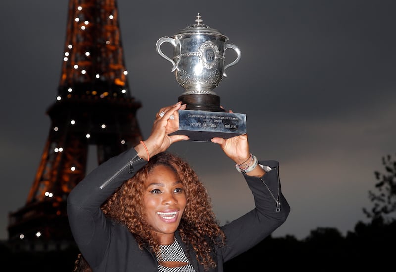 Serena Williams poses with her trophy after defeating Russia's Maria Sharapova in the 2013 French Open final. AP