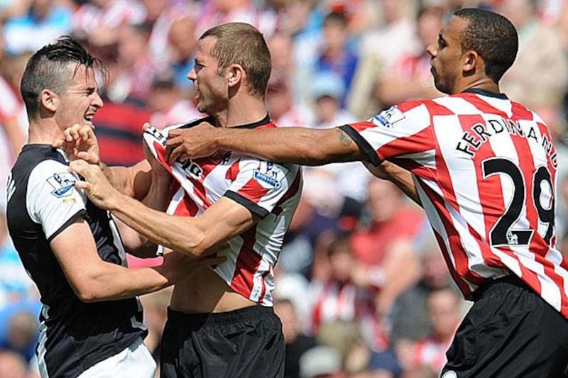 It seems Newcastle's Joey Barton, left, does not need a reason to get under someone's skin as he has a frank exchange with Sunderland's Phil Bardsley and Anton Ferdinand in heated Tyne-Wear derby. Bardsley was sent off. 

Owen Humphreys / PA / AP Photo