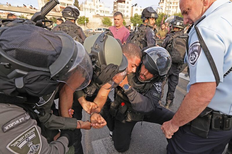 Israeli security forces detain a Palestinian during a protest. AFP