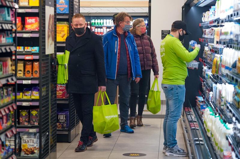 Customers browse around the Amazon Fresh store. AFP