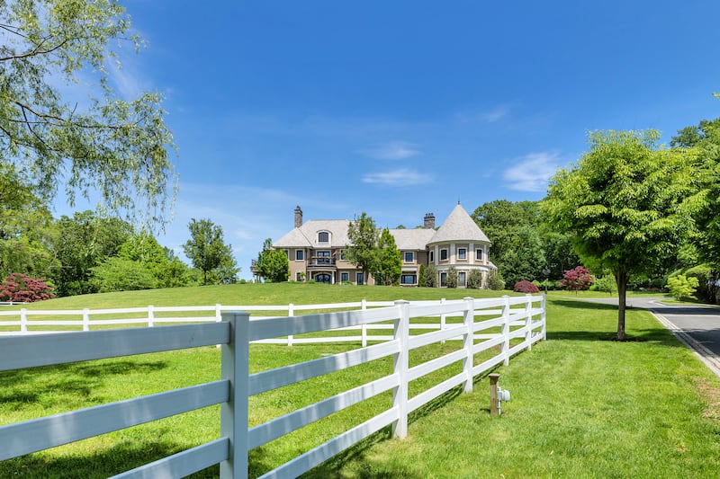 There's a riding ring, a 10-stall stable with apartment and tack room. Courtesy Douglas Elliman Realty