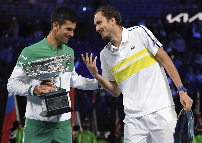 Novak Djokovic and Daniil Medvedev after the trophy presentation. AP