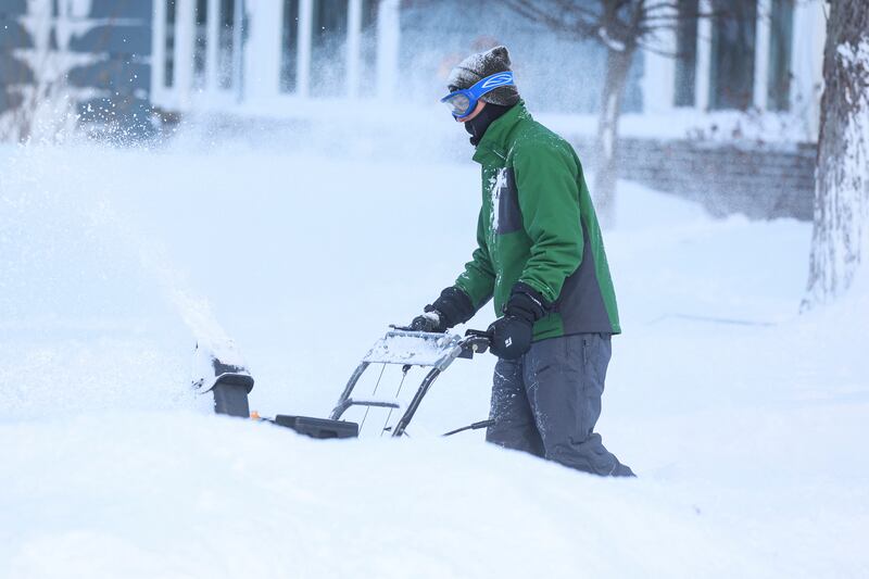 A man battles the snow on his driveway in Buffalo. Reuters