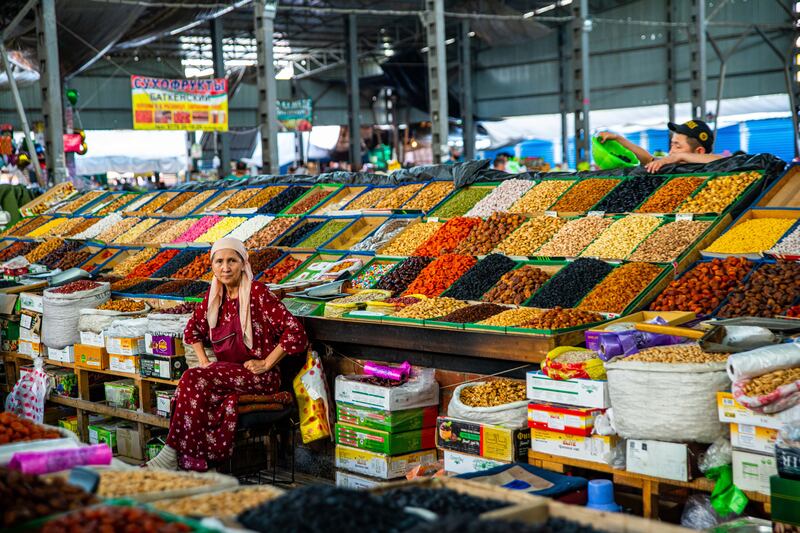A woman sells dry fruit and nuts in Bishkek's Osh Bazaar. All photos: Getty Images