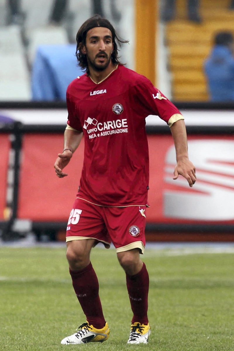 Livorno midfielder Piermario Morosini reacts during a second league match against Pescara where he suffered a suspected heart-attack on April 14, 2012 in Pescara. The 31-year-old player has died after he collapsed suddenly on the pitch during the game.  AFP PHOTO / Luciano Pieranunzi (Photo by PIERANUNZI LUCIANO / AFP)