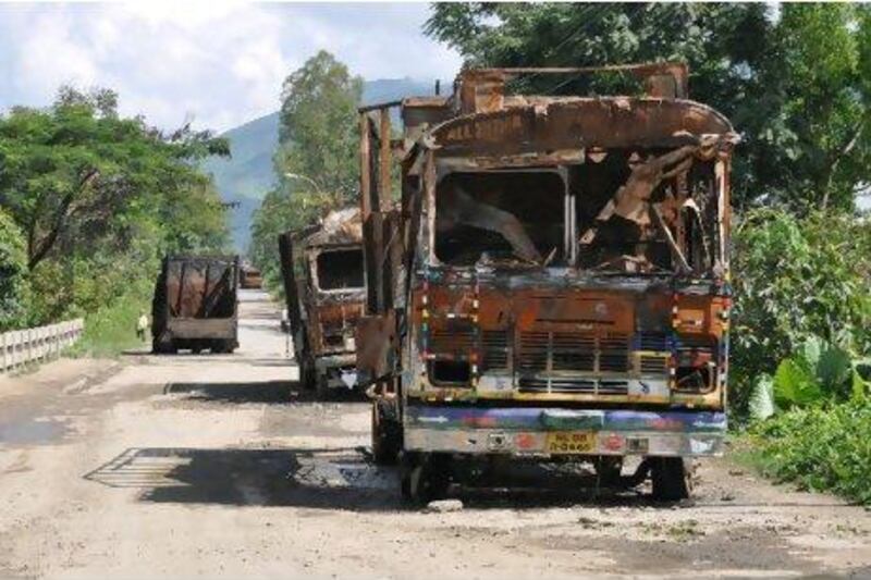 Vehicles burned out on National Highway 39 by protesters demanding a new district of Sardar Hills, who have imposed an economic blockade on the area.