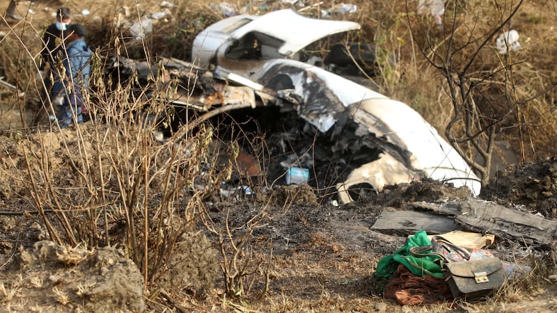 Passengers' belongings litter the crash site of the Yeti Airlines ATR72 aircraft in Pokhara, Nepal. EPA