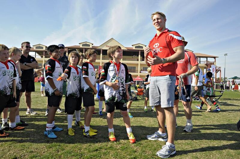 Children taking part in the HSBC Rugby Festival at the Rugby Sevens complex in Dubai City meet Lewis Moody. Jeff Topping for The National