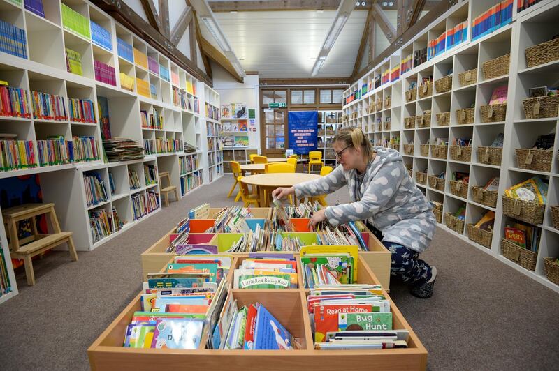 A teacher prepares the library at The Prince of Wales School in Dorchester. Getty Images