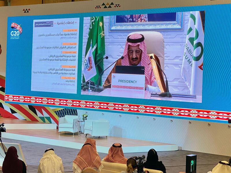 Media watches Saudi King Salman bin Abdulaziz's virtual speech live at the media centre during an opening session of the 15th annual G20 Leaders' Summit in Riyadh, Saudi Arabia November 21, 2020. REUTERS/Nael Shyoukhi