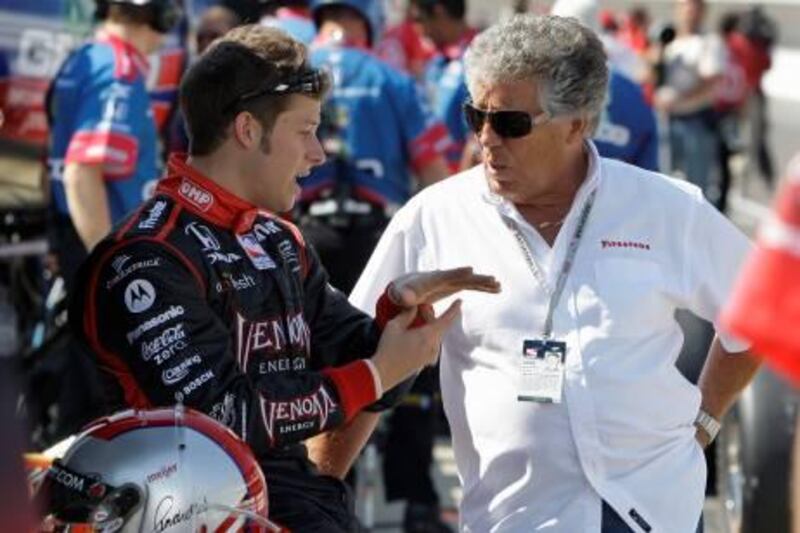 Marco Andretti, left, talks with his grandfather and former Indianapolis 500 winner Mario Andretti, before the final practice session for the Indianapolis 500 auto race at the Indianapolis Motor Speedway in Indianapolis, Friday, May 22, 2009. The 93rd running of the race is Sunday. (AP Photo/Darron Cummings)