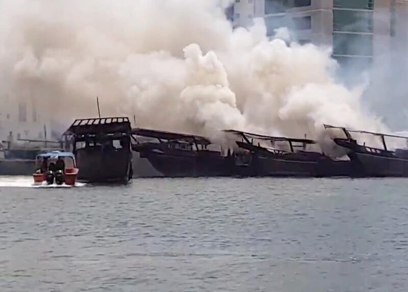 Fire destroyed several wooden fishing boats in Sharjah Creek on Monday morning. Credit: Al Roeya 