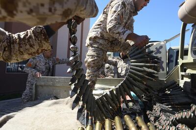 (FILES) In this file photo taken on April 08, 2019, fighters from a Misrata armed group loyal to the internationally recognised Libyan Government of National Accord (GNA) prepare their ammunition before heading to the frontline as battles against Forces of Libyan strongman Khalifa Haftar, in Tripoli The US charged on July 16, 2020, that the EU's Operation Irini to enforce a UN embargo on sending weapons to war-torn Libya lacked seriousness, sharing Turkey's criticism that the effort is biased. / AFP / Mahmud TURKIA
