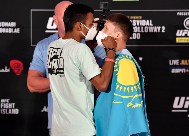 ABU DHABI, UNITED ARAB EMIRATES - JULY 10: (L-R) Opponents Raulian Paiva of Brazil and Zhalgas Zhumagulov of Kazakhstan face off during the UFC 251 official weigh-in inside Flash Forum at UFC Fight Island on July 10, 2020 on Yas Island Abu Dhabi, United Arab Emirates. (Photo by Jeff Bottari/Zuffa LLC)