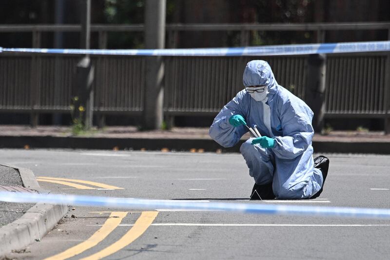 A forensic officer uses a swab outside Forbury Gardens, on June 22, 2020 in Wokingham, England. Getty Images