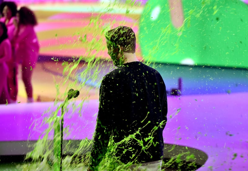 Donaldson gets slimed onstage during the 2022 Nickelodeon Kids' Choice Awards. AFP