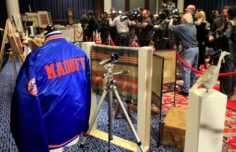 A New York Mets baseball jacket, personalised for Bernard Madoff, is displayed during an auction preview of his seized items, in New York on November 13, 2009. The epic Ponzi scheme mastermind is dead, but the effort to untangle his web of deceit lives on. AP