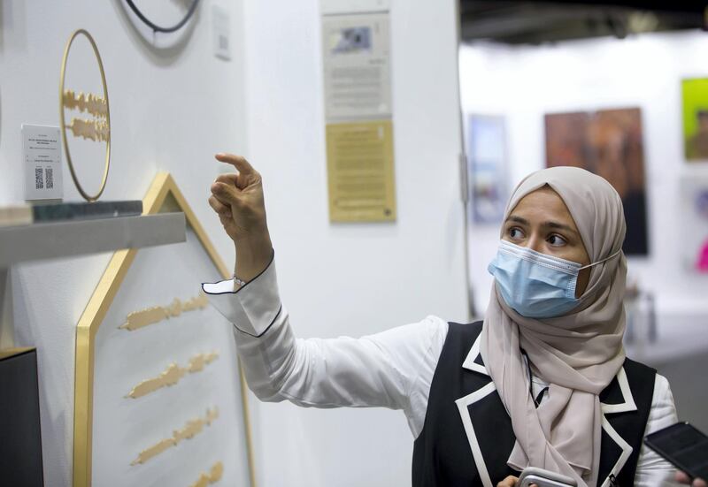 Dubai, United Arab Emirates - Artist Sara Alharbali with her artworks called Tajrid at the World Art Dubai at Dubai World Trade Centre.  Leslie Pableo for The National for Razmig's story