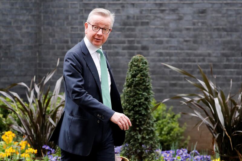 Britain's Chancellor of the Duchy of Lancaster Michael Gove arrives at Downing Street in central London on March 2, 2020, ahead of an emergency COBRA meeting into UK's developing coronavirus COVID-19 situation.  Britain's Prime Minister Prime Minister will on Monday Chair an emergency COBRA meeting on the coronavirus outbreak, after the number of confirmed cases of COVID-19 in the United Kingdom rose to 36. / AFP / Tolga AKMEN
