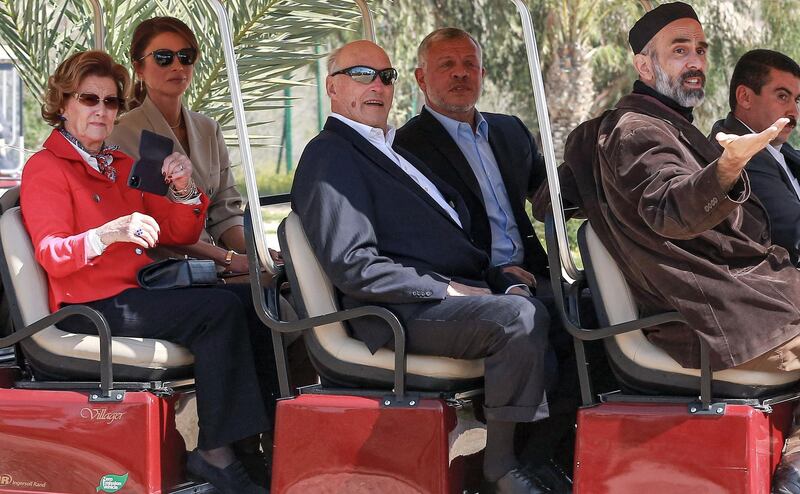 Queen Sonja of Norway, Queen Rania of Jordan, King Harald V of Norway, King Abdullah II of Jordan, and Prince Ghazi bin Muhammad (King Abdullah II's cousin and his chief advisor on religious and cultural affairs) ride together in a golf cart at the baptism site of al-Maghtas, where Jesus is believed by Christians to have been baptised by John the Baptist, on the Jordan river.   AFP