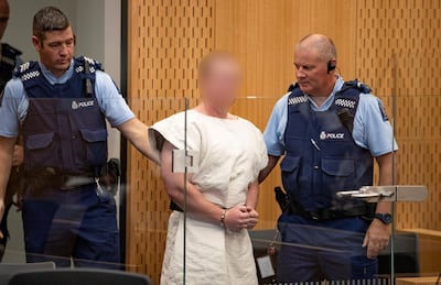 Brenton Tarrant, charged for murder in relation to the mosque attacks, is lead into the dock for his appearance in the Christchurch District Court, New Zealand March 16, 2019.   Mark Mitchell/New Zealand Herald/Pool via REUTERS. ATTENTION EDITORS - PICTURE PIXELATED AT SOURCE. SUSPECT FACE MUST BE PIXELATED. ONLY HIS FACE.