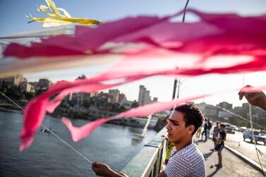 A man flies a kite on a bridge over the river Nile River in Cairo, Egypt, 30 June. EPA