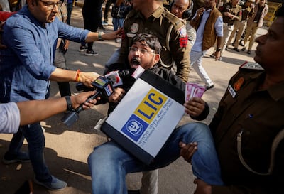 Police arrest an activist in New Delhi on Monday. Reuters