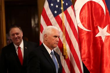 US Vice President Mike Pence (R) and US Secretary of State Mike Pompeo (L) arrive at a press conference at the US Embassy in Ankara on Thursday. AFP