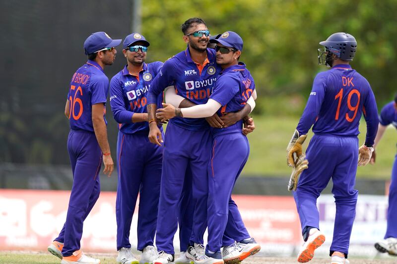 India bowler Axar Patel, centre, celebrates with his teammates after bowling West Indies' Shamarh Brooks during the fifth and final T20 n Lauderhill, Florida. AP