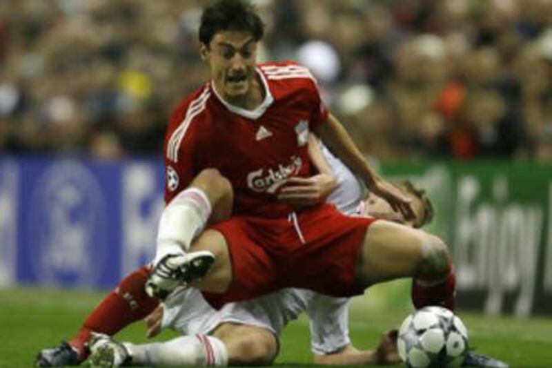 Albert Riera fights for the ball during Liverpool's 3-1 Champions League win against PSV Eindhoven.