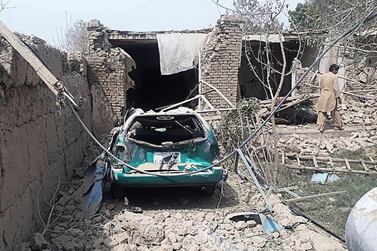 In this handout photograph taken on August 25, 2020 and released by the Afghan Ministry of Defence press office (MOD), a man inspect damaged houses near the site where a suicide bomber detonated an explosives in a truck, in Balkh district of Balkh province. At least three people were killed when a suicide bomber detonated explosives in a truck near an Afghan army base on August 25, in an attack claimed by the Taliban, officials said. - RESTRICTED TO EDITORIAL USE - MANDATORY CREDIT "AFP PHOTO /Afghan Ministry of Defense (MOD) " - NO MARKETING - NO ADVERTISING CAMPAIGNS - DISTRIBUTED AS A SERVICE TO CLIENTS / AFP / Ministry of Defence Afghanistan (MOD) / HANDOUT / RESTRICTED TO EDITORIAL USE - MANDATORY CREDIT "AFP PHOTO /Afghan Ministry of Defense (MOD) " - NO MARKETING - NO ADVERTISING CAMPAIGNS - DISTRIBUTED AS A SERVICE TO CLIENTS