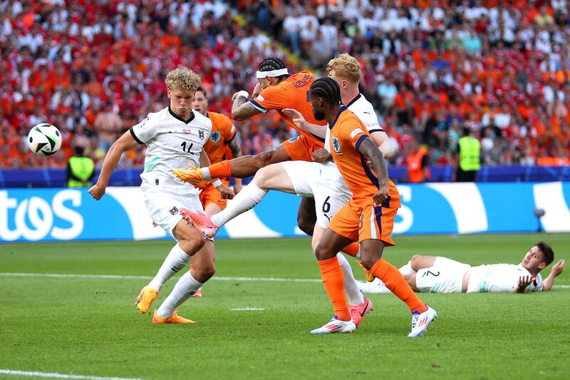 Memphis Depay of the Netherlands scores his team's second goal against Austria. Getty Images