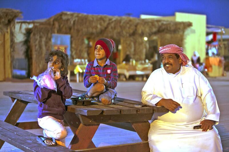 People enjoying the outdoors during their visit to the Zayed Heritage Festival. Silvia Razgova / The National