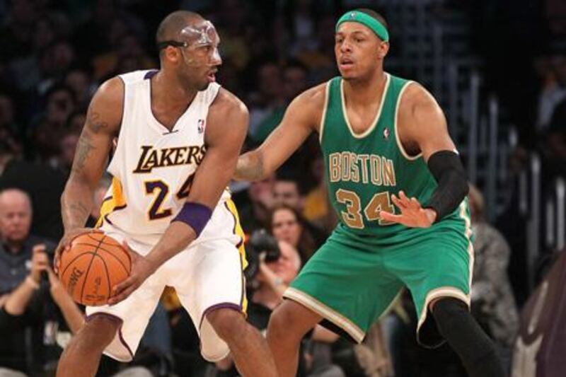 LOS ANGELES, CA - MARCH 11: Kobe Bryant #24 of the Los Angeles Lakers controls the ball against Paul Pierce #34 of the Boston Celtics at Staples Center on March 11, 2012 in Los Angeles, California. The Lakers won 97-94. NOTE TO USER: User expressly acknowledges and agrees that, by downloading and or using this photograph, User is consenting to the terms and conditions of the Getty Images License Agreement.   Stephen Dunn/Getty Images/AFP== FOR NEWSPAPERS, INTERNET, TELCOS & TELEVISION USE ONLY ==

