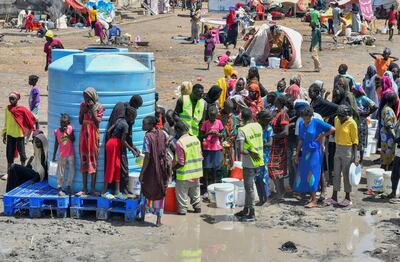 People fleeing the fighting in Sudan queue for water at the UN High Commissioner for Refugees transit centre in Renk, near the border with South Sudan. Reuters