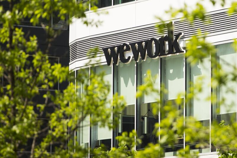 WeWork Cos Inc. signage is displayed outside a location in the Seaport neighborhood of Boston, Massachusetts, U.S., on Sunday, May 26, 2019. No American city has left such a large swath of expensive new oceanfront real estate and infrastructure exposed to the worst the environment has to offer, according to Chuck Watson, owner of Enki Research. The expansion totals 1,000 acres, an area bigger than Manhattan's Central Park. Photographer: Adam Glamzman/Bloomberg