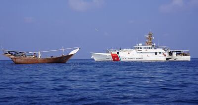 A US Coastguard cutter next to the vessel that was reportedly carrying the shipment of Iranian weapons. Centcom / AFP