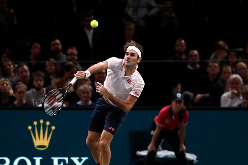 Roger Federer of Switzerland serves the ball to Novak Djokovic of Serbia during their semifinal match of the Paris Masters tennis tournament at the Bercy Arena in Paris, France, Saturday, Nov. 3, 2018. (AP Photo/Thibault Camus)