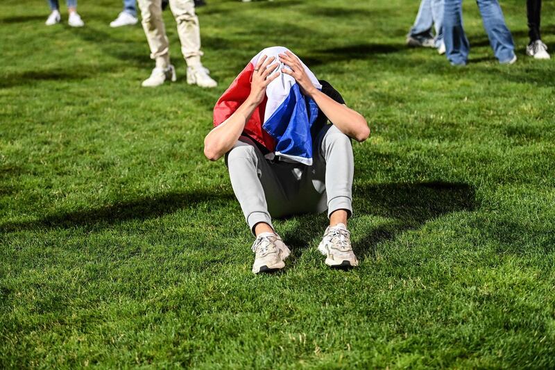 French supporters react in a fan zone at a stadium in Gerland, near Lyon. AFP