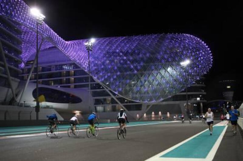 Abu Dhabi, United Arab Emirates ---  January 11, 2011  ---  Bike riders, walkers and runners take to the track at Yas Marina track on Yas Island on Tuesday night.  ( DELORES JOHNSON / The National )