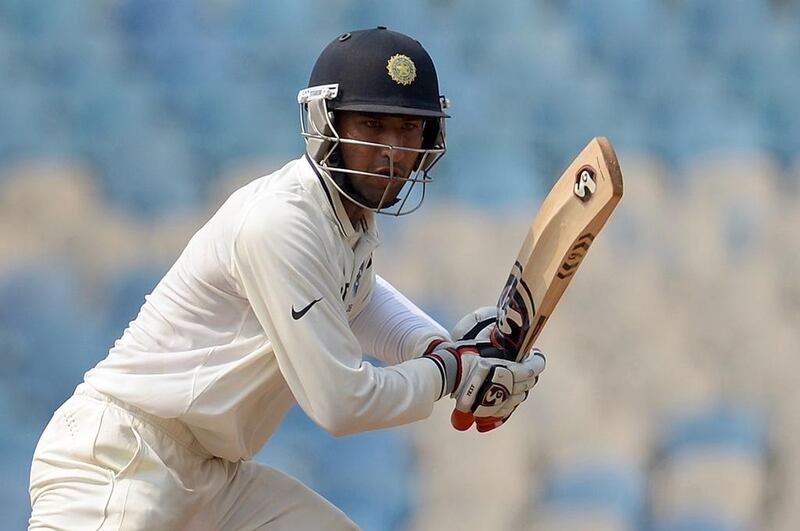 Cheteshwar Pujara is seen as being in competition with Rohit Sharma for a place in India's XI. Punit Paranjpe / AFP