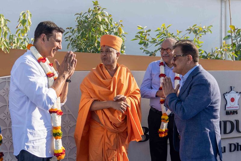 The Bollywood actor's planned 40-minute visit to the Hindu temple lasted two hours 