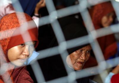 Cambodian Muslims sit at the the Extraordinary Chambers in the Courts of Cambodia (ECCC), as they wait for a verdict on the former Khmer Rouge head of state Khieu Samphan and former Khmer Rouge leader ''Brother Number Two'' Nuon Chea, on the outskirts of Phnom Penh, Cambodia, November 16, 2018. Reuters/Samrang Pring